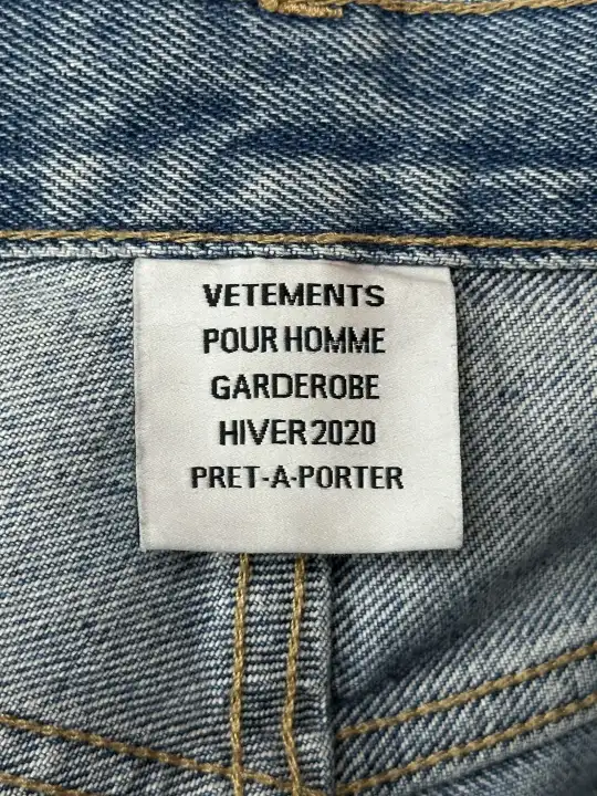 Vetements VETEMENTS FW19 Demna Anarchy Logo Distressed Blue Jeans, detail view 16