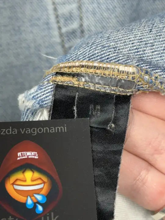 Vetements VETEMENTS FW19 Demna Anarchy Logo Distressed Blue Jeans, detail view 19